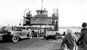 Black and white photograph of the Algoming ferry being loaded with cars